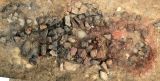 Grinded and washed ore deposit (ore concentrate) from the floor of container Nr. 0549 just washed at excavation.